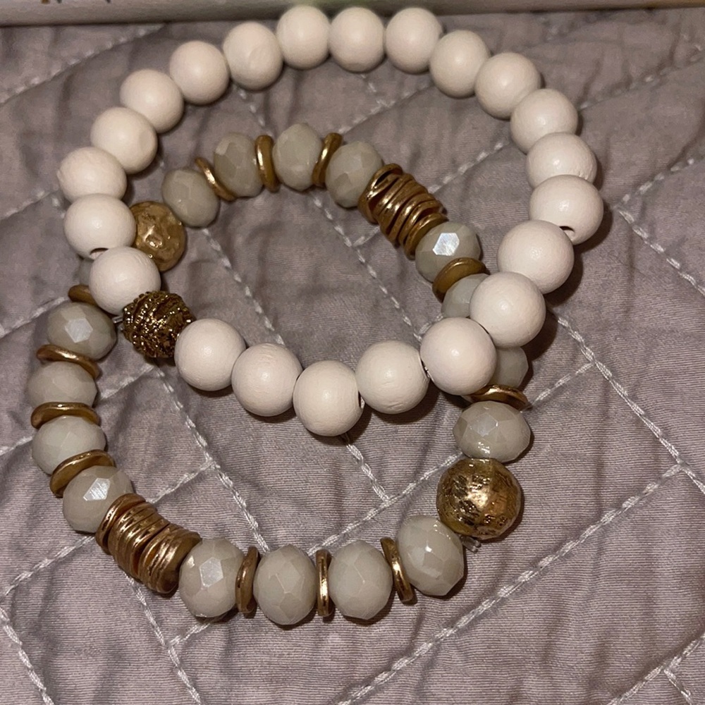 White and gold bracelets.